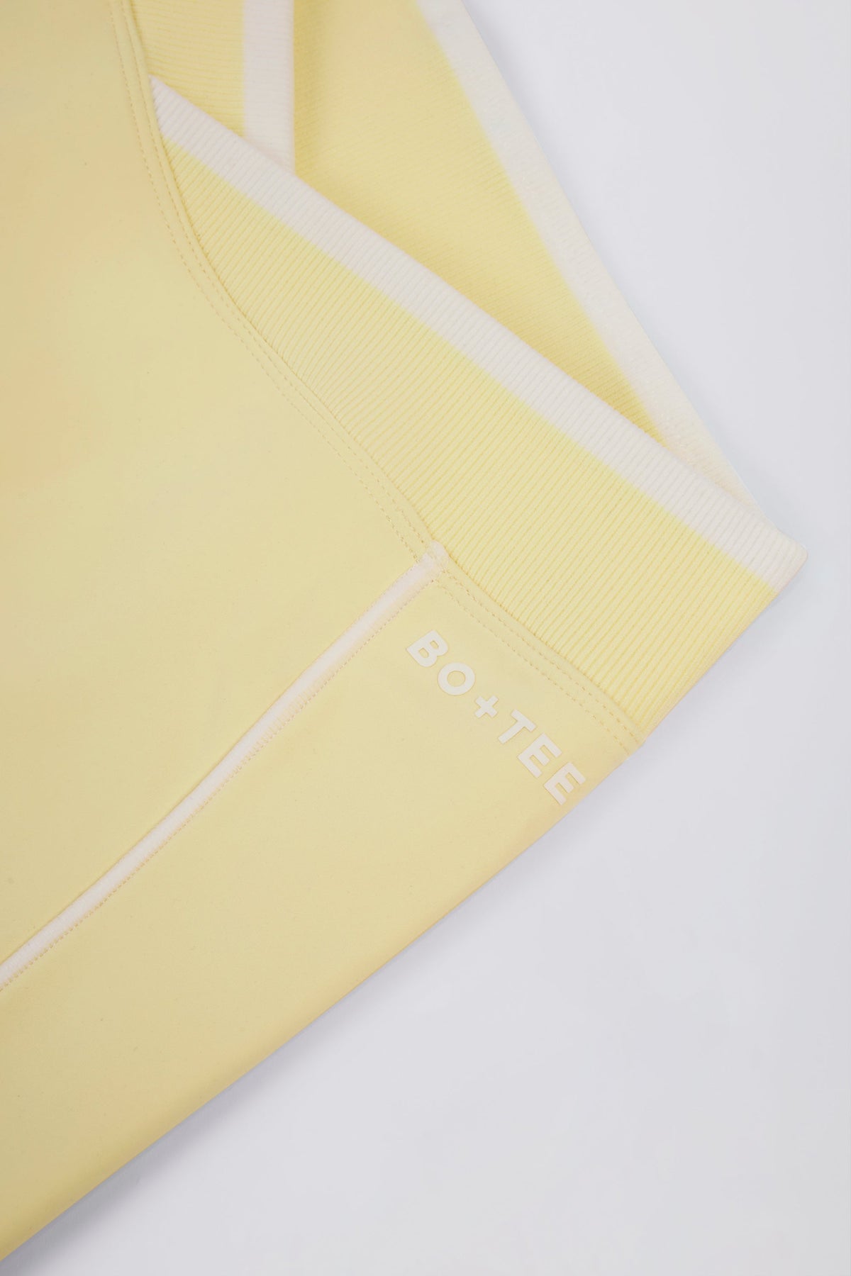Chic Soft Active Wrapover Contrast Mini Shorts in Soft Yellow