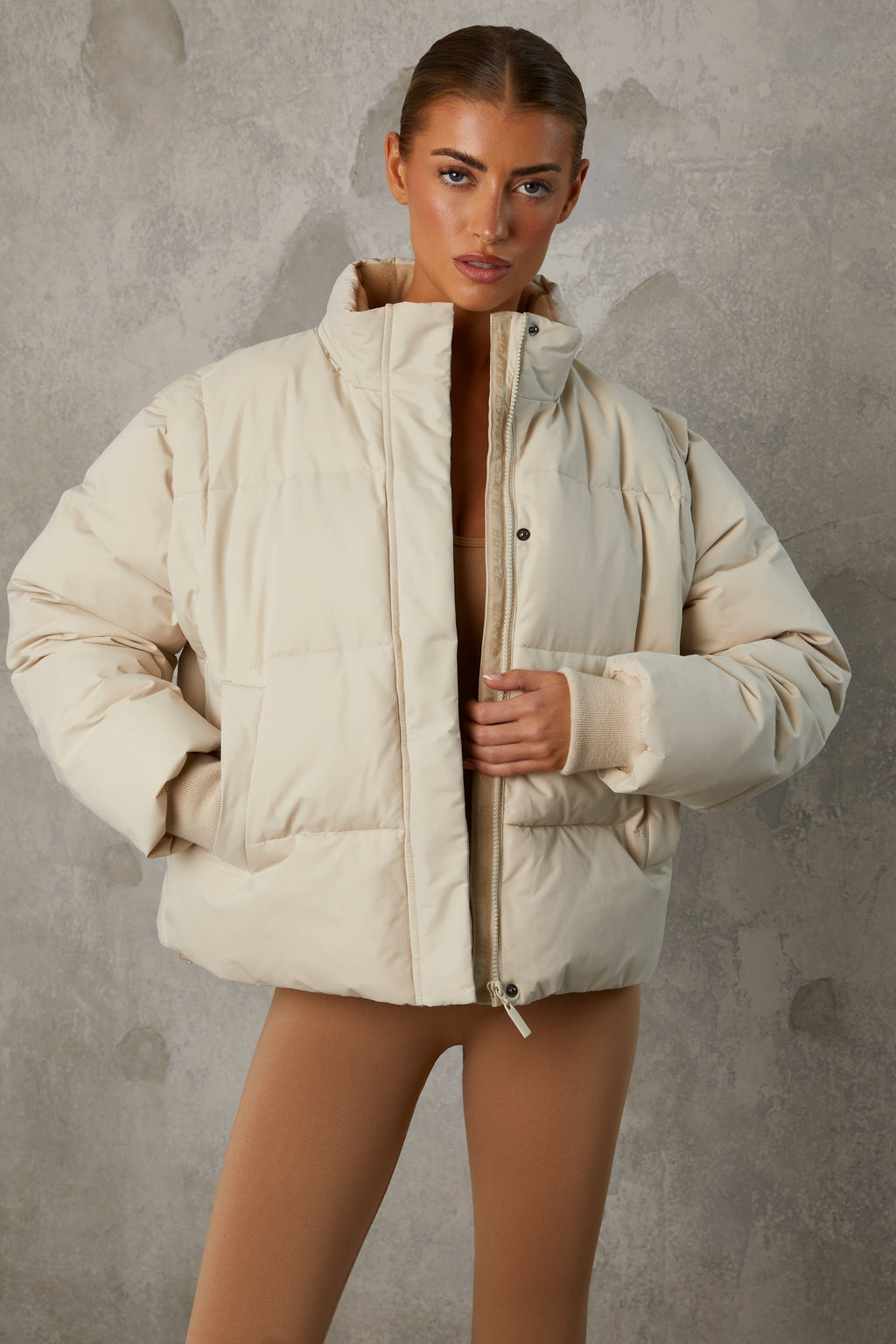 Chic Cropped Puffer Jacket with Detachable Sleeves in Sand
